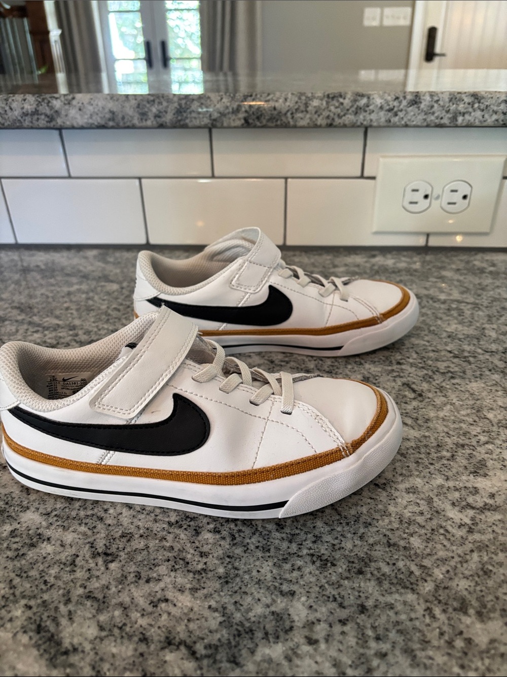 Nike Kids 13C White Sneakers with Black Swoosh and Tan Accent